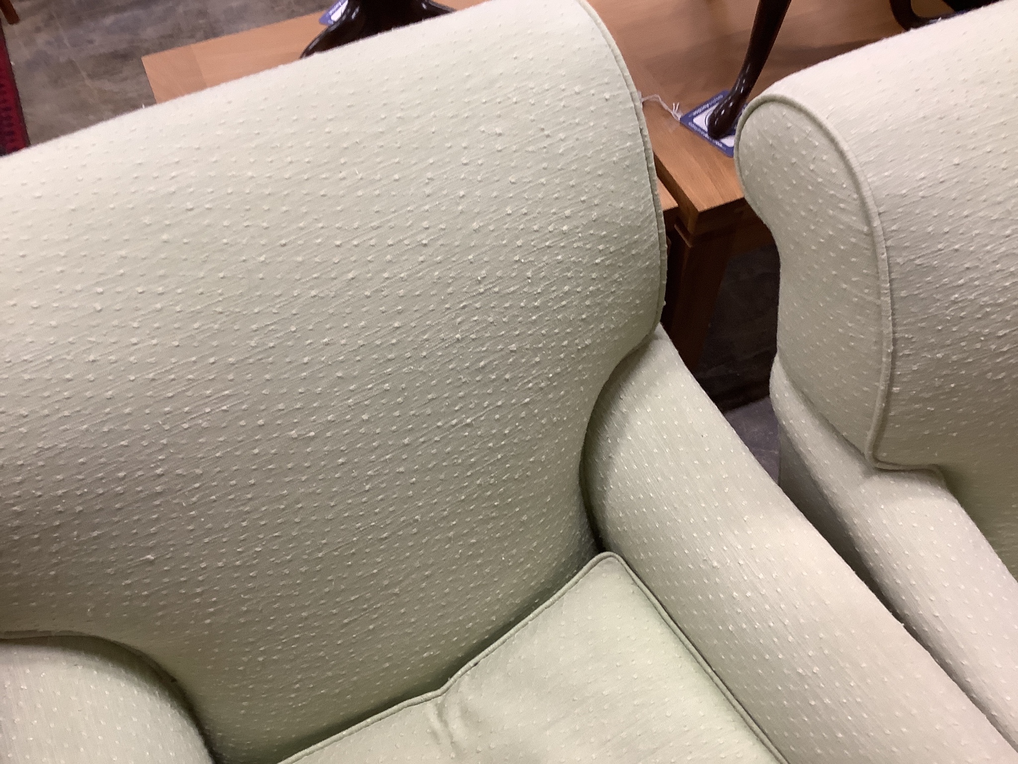 A pair of Howard style armchairs upholstered in lime green fabric. W-70, D-94, H-80cm.